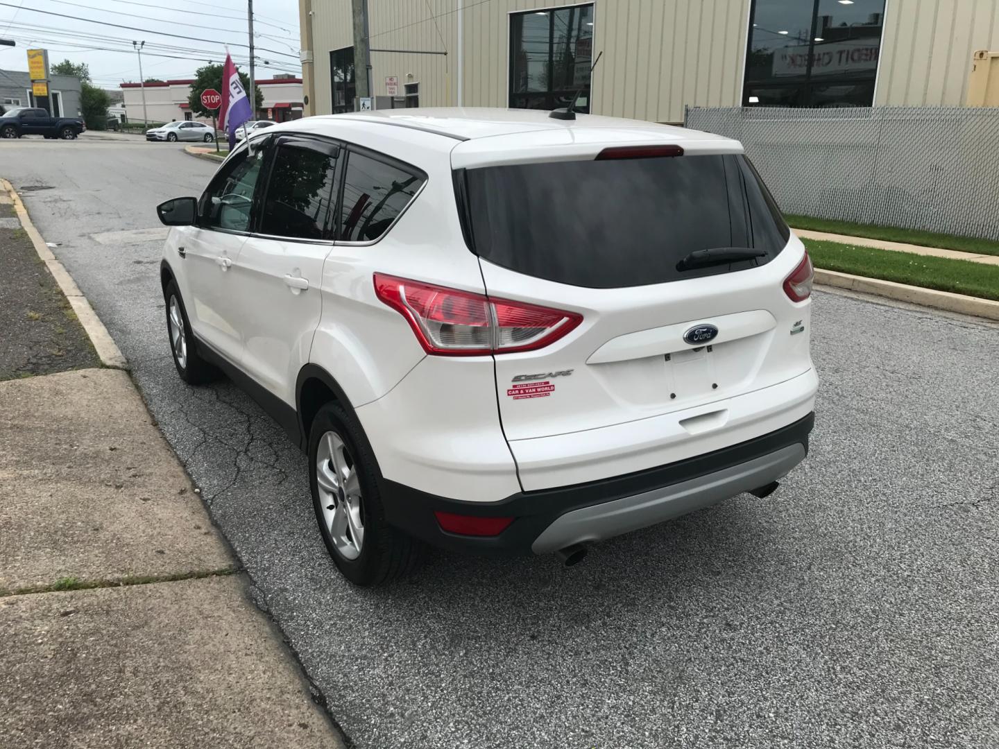 2016 White /Gray Ford Escape SE (1FMCU9GX9GU) with an 1.6 V4 engine, Automatic transmission, located at 577 Chester Pike, Prospect Park, PA, 19076, (610) 237-1015, 39.886154, -75.302338 - 2016 Ford Escape SE: Only 135k miles, 4x4, SUPER CLEAN, runs LIKE NEW! This vehicle comes inspected and has been given a bumper to bumper safety check. It is very clean, reliable, and well maintained. We offer a unique pay plan that is known for being the easiest and fastest financing option in t - Photo#5